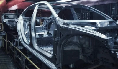 What is electrophoresis in automotive manufacturing, and what is its function?